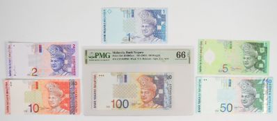 Six Malaysia 1996-2000 issue banknotes including 2001 100 Ringgit PMG graded 66 'Gem Uncirculated'