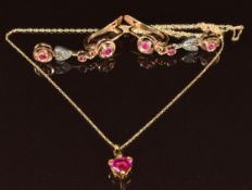 A pair of 14k gold earrings set with synthetic rubies (5.7g) and a 9k gold pendant set with a