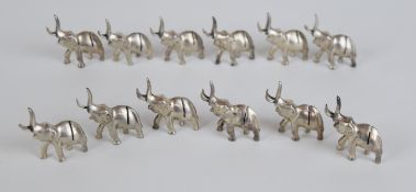 A set of twelve novelty silver plated place card holders in the form of elephants