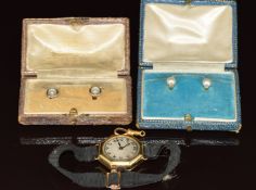 An 18ct gold octagonal watch, a 15ct gold clip (1g), a pair of 18ct gold studs set with a pearl (3.