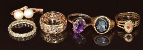Three 9ct gold rings, one set with an amethyst, one with hematite and the other spinel (8.4g),