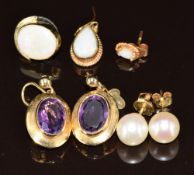 A pair of yellow metal earrings each set with an oval cut amethyst (6.8g), a pair of 18k gold