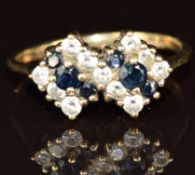 A 9ct gold ring set with cubic zirconia and sapphires, 1.9g, size K