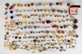 Sixty-five pairs of vintage earrings including Trifari, Monet, Ciro, Carolina Herrera, Joan