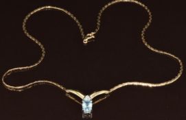 A 9ct necklace set with an oval cut topaz and diamonds, 5.7g, 40cm
