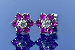 A pair of 18ct white gold earrings each set with a round cut diamond of approximately 0.17ct