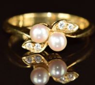 An 18ct gold ring set with pearls and diamonds, 3.3g, size M