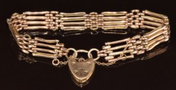 A 9ct rose gold gate bracelet with heart padlock clasp, 12.7g, 19cm