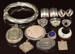 A collection of silver jewellery including bangle, fob, St Christopher, Victorian locket, brooch,