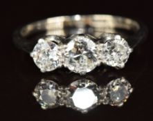 An 18ct white gold ring set with three diamonds of approximately 0.45, 2.5 & 0.25ct, 2.7g, size L