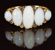 An 18ct gold ring set with five oval opal cabochons and rose cut diamonds, Birmingham 1921, 4.8g,