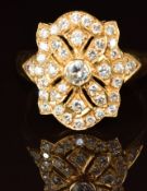 An 18ct gold ring set with diamonds, the centre diamond approximately 0.18ct, 6g, size S