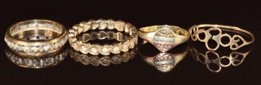 Two 9ct gold eternity rings, 9ct gold signet ring and 9ct gold ring in a abstract design, 5.9g