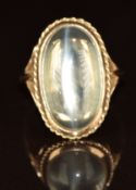 A 9ct gold ring set with a moonstone cabochon, 5.8g, size N