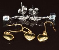 A pair of 9k white gold earrings each set with a diamond and aquamarine (1.5g) and a pair of 18k