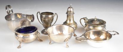 Hallmarked silver items comprising sauce boat, tea strainer on stand, salt, mustard, pepper and