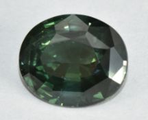 A loose natural oval cut green sapphire of approximately 4.1ct, with valuation from Martin & Co,