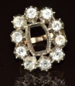 A yellow metal and silver ring set with foiled paste, 10.8g, size O (centre stone missing)