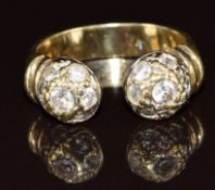 A 9ct gold torque ring set with cubic zirconia, 5.9g, size S