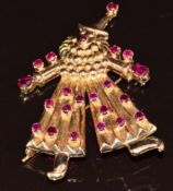 An 18ct gold brooch in the form of a clown set with round and pear cut rubies, the largest pear