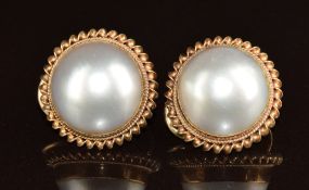 A pair of 9ct gold earrings set with mabe pearls, 8.4g