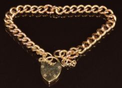 A 9ct gold curb link bracelet with heart padlock clasp, 22g, 18cm
