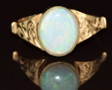 A 9ct gold ring set with an opal, with engraved shoulder decoration, 1.8g, size O