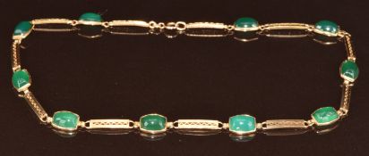 A 9ct gold necklace set with green agate cabochons and elongated links, 13g, 34cm
