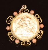 1912 gold half sovereign in 9ct gold pendant mount set with coral, 9g