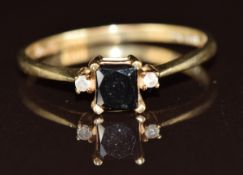 A 9ct gold ring set with a black diamond and further diamonds, 2g, size U