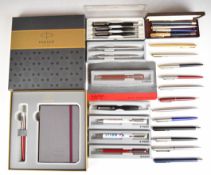 Twenty-seven Parker ballpoint and rollerball pens including advertising examples, some in original