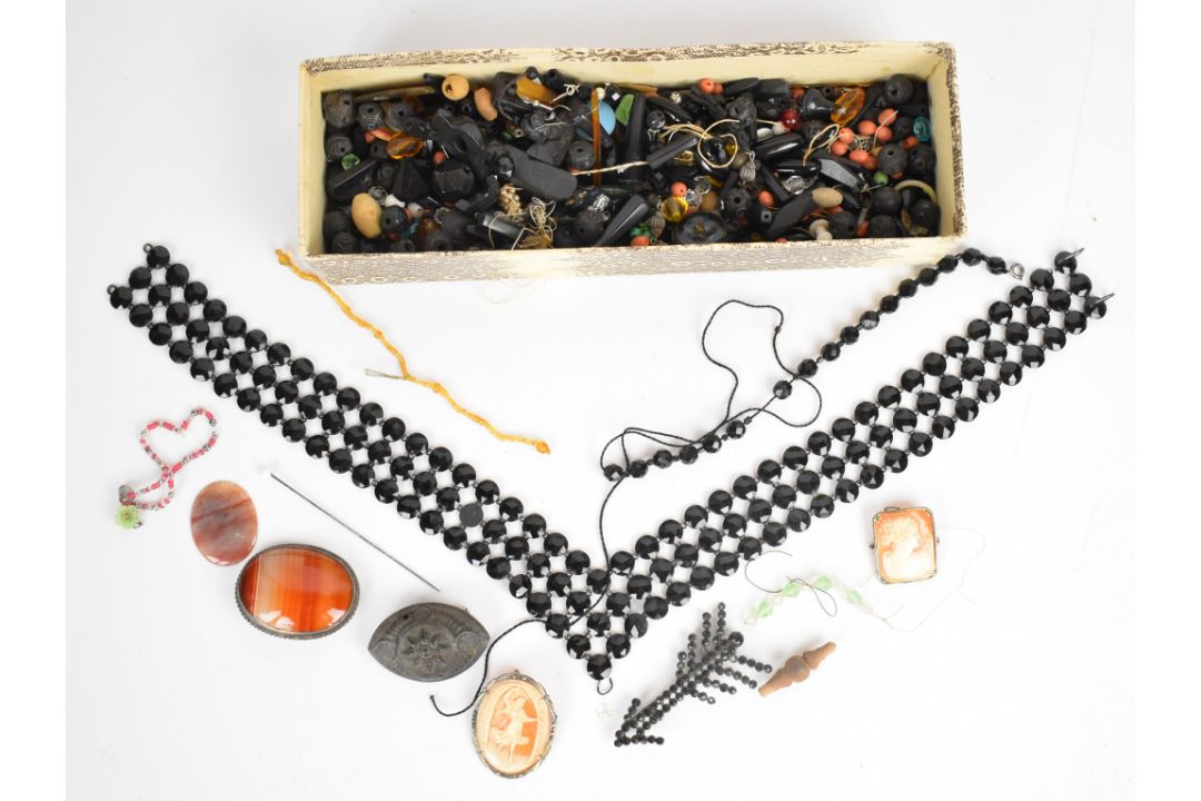 A collection of loose jet beads, French jet necklace, two cameo brooches, agate brooch, three - Image 1 of 6