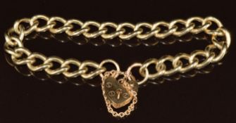 A 9ct gold curb link bracelet with 9ct gold heart padlock, 24.5g, 18cm