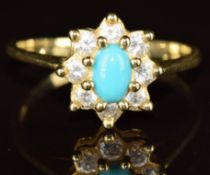 A 14k gold ring set with a turquoise cabochon and cubic zirconia, 2.8g, size P