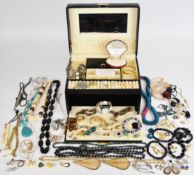A collection of jewellery including vintage earrings, silver earrings, two silver rings, and a