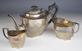 George V hallmarked silver three piece tea set with reeded lower bodies, Chester 1919, maker