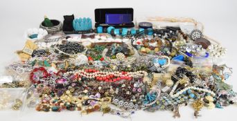 A collection of jewellery including beaded necklaces, peridot and pearl necklace, peridot and