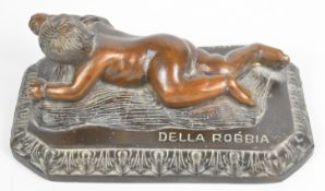 Bronze figure of a cherub holding fruit, with Della Robbia impressed to base, L20cm x H8.5cm