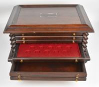 Coin collectors cabinet of five drawers, each with inserts to hold coins, with barley twist