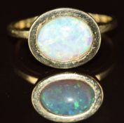 A 9ct gold ring set with a synthetic opal, 4g, size P