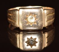 A 9ct rose gold ring set with a synthetic stone in a star setting, 4.8g, size O