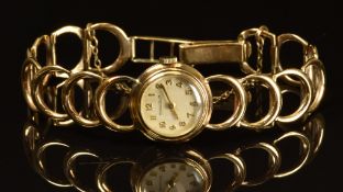 Jaeger LeCoultre 9ct gold ladies wristwatch with gold hands and Arabic numerals, silver dial and