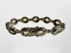 A small silver stone set bracelet