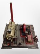 A Mamod live steam piston engine on plinth,