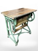 A Ewbank cast iron and pine mangle,