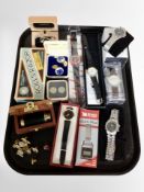 A group of lady's and gent's quartz wrist watches, buttons, Rolls razor in original box,
