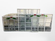 A group of stained and leaded glass windows,