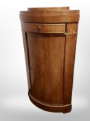 A 19th century Danish mahogany and satinwood inlaid bow fronted corner cabinet,