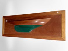 A teak relief picture of a boat,