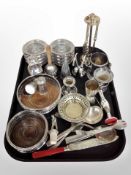 A group of silver plated bottle coasters, cutlery, sifter,